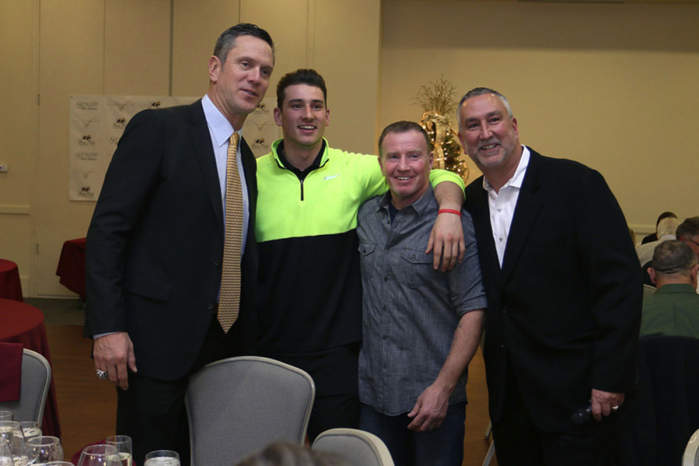 Former Patriots quarterback Drew Bledsoe, left, at a wine-tasting at Four Oaks Country Club in Dracut last December with, from left, Michael Kuenzler Jr., of Dracut, Micky Ward of Lowell, and Michael Kuenzler Sr., owner of Four Oaks. SUN FILE PHOTO